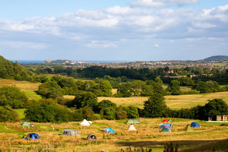 Our campsite in Scarborough near the beach. With a sea view, you can almost feel the sand between your toes.
